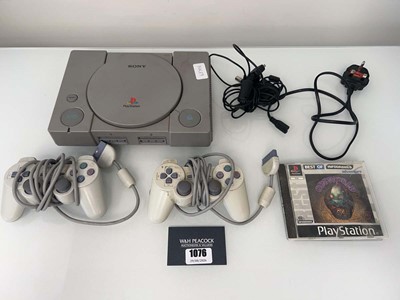 Lot 1076 - Sony PlayStation with two PSone controllers...