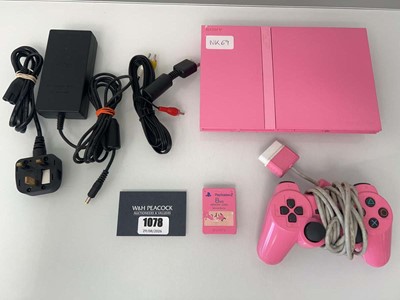 Lot 1078 - Pink Sony PlayStation 2 Slimline with one...
