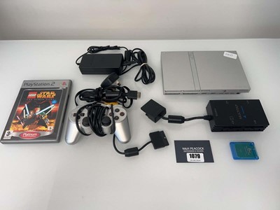 Lot 1079 - Silver Sony PlayStation 2 Slimline with one...