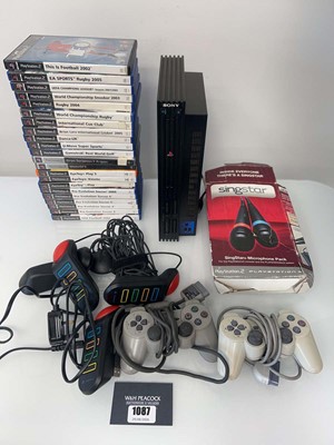 Lot 1087 - Sony PlayStation 2 with two controllers,...