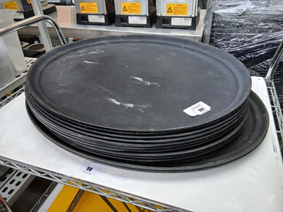 Lot 101 - Stack of large black rubberised oval platters