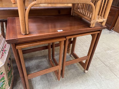Lot 98 - A mid century teak nest of three tables one...