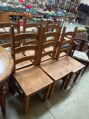 Lot 76 - A set of six pine ladder back dining chairs