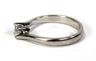 Lot 791 - A platinum ring set brilliant cut diamond in a...