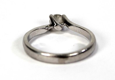 Lot 791 - A platinum ring set brilliant cut diamond in a...