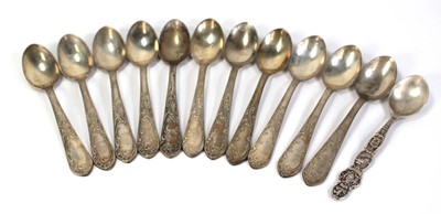 Lot 206 - A set of eleven silver teaspoons decorated...