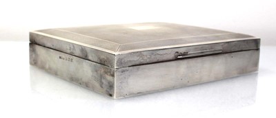 Lot 215 - A silver engine turned cigarette box of...