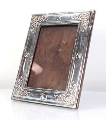 Lot 219 - A silver easel back photograph frame with...