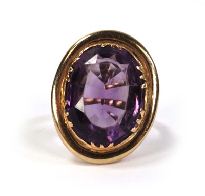 Lot 792 - A 9ct yellow gold ring set oval amethyst...