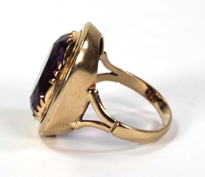 Lot 792 - A 9ct yellow gold ring set oval amethyst...