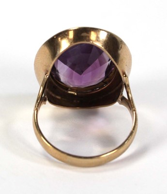 Lot 792 - A 9ct yellow gold ring set oval amethyst...