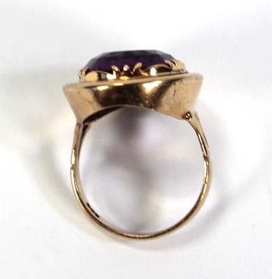 Lot 792 - A 9ct yellow gold ring set oval amethyst...
