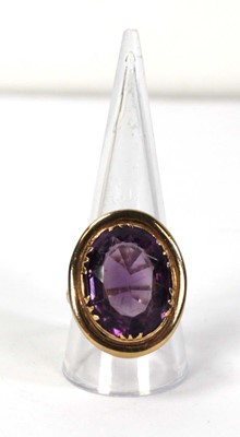 Lot 792 - A 9ct yellow gold ring set oval amethyst...