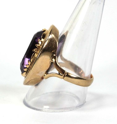 Lot 792 - A 9ct yellow gold ring set oval amethyst...