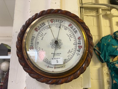 Lot 5 - A wooden mounted circular aneroid barometer