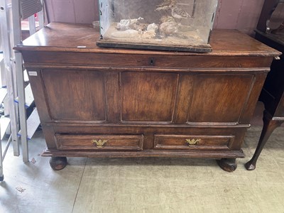 Lot 45 - An oak panelled coffer with drawers under