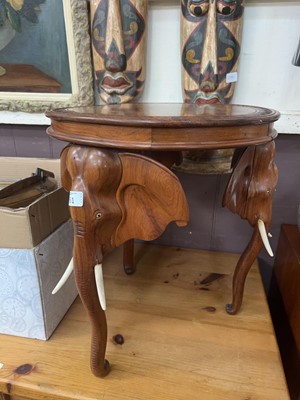 Lot 61 - An elephant decorated three leg side table