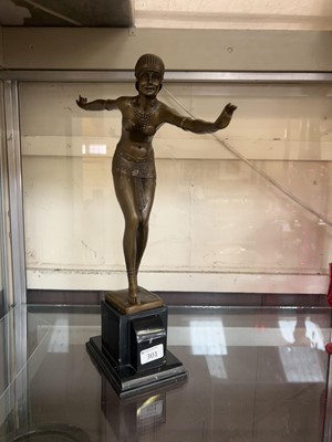 Lot 301 - A bronzed metalwork figure of an Art Deco lady...