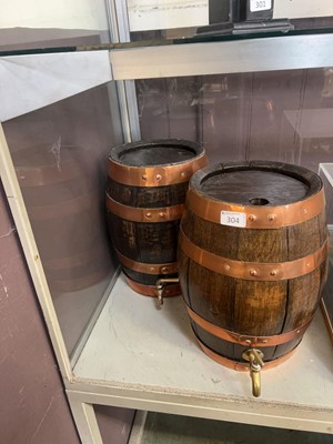 Lot 304 - A pair of copper banded oak casks with taps...