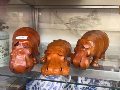 Lot 307 - Three leather bound models of hippopotamuses...