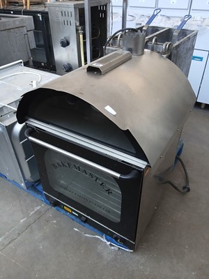 Lot 633 - 65cm electric Bakemaster bench top bake potato...