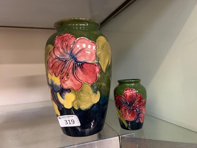 Lot 319 - A green ground Moorcroft vase along with one...