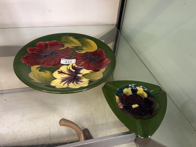 Lot 322 - A Moorcroft green ground plate along with a...
