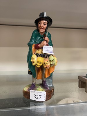 Lot 327 - A Royal Doulton figurine 'The Mask Seller'
