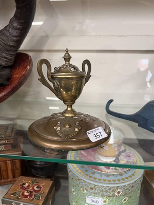 Lot 357 - An ornate brass inkwell with embossed...