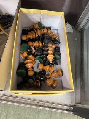 Lot 383 - A box containing assorted chess pieces