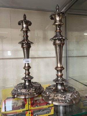 Lot 396 - A pair of armorial plated candlesticks with...