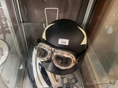 Lot 408 - A star patterned Harley Davidson helmet with...