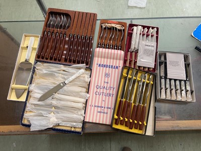 Lot 410 - A box of assorted cutlery sets to include teak...