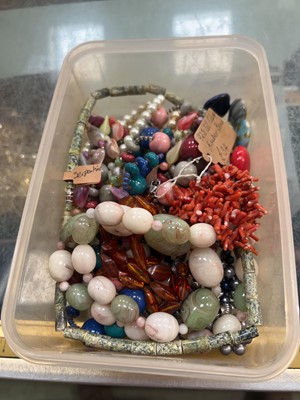 Lot 418 - A tub of various bead necklaces, amber...