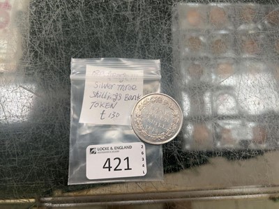Lot 421 - A bag containing three shilling bank token