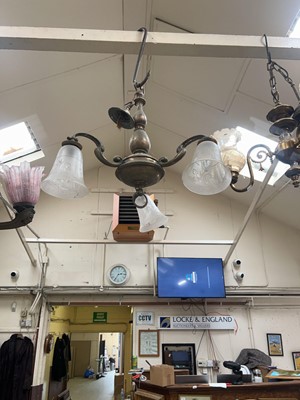 Lot 103 - A metal and glass three branch light fitting
