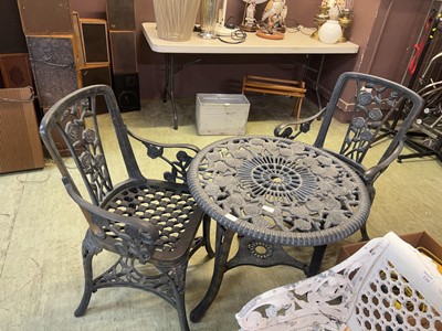 Lot 115 - A plastic garden table with two matching chairs