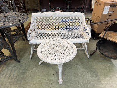 Lot 116 - A white painted cast metal garden bench along...