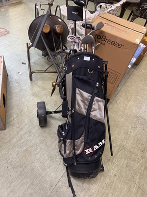 Lot 119 - A brown golf bag containing assorted clubs by...