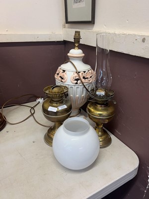 Lot 127 - Two brass and glass oil lamps along with a...