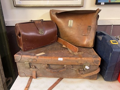 Lot 133 - A vintage leather trunk along with leather...