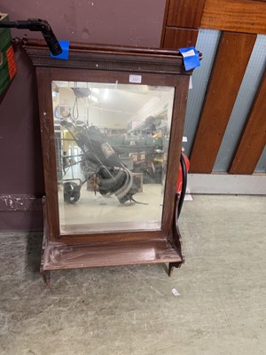 Lot 137 - A mahogany framed wall mirror with shelf