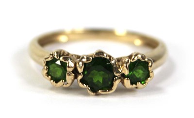 Lot 797 - A 9ct yellow gold ring set three graduated...