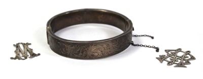 Lot 800 - A silver hinged bracelet, Chester1949 and two...