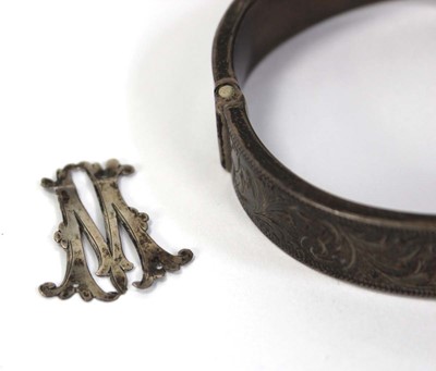 Lot 800 - A silver hinged bracelet, Chester1949 and two...