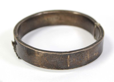 Lot 800 - A silver hinged bracelet, Chester1949 and two...