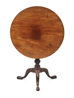 Lot 16 - A George III mahogany circular tilt-top table...