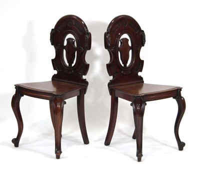 Lot 17 - A pair of Victorian mahogany hall chairs with...