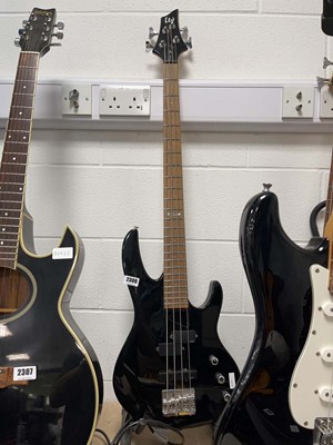 Lot 2306 - Ltd four string bass guitar in black