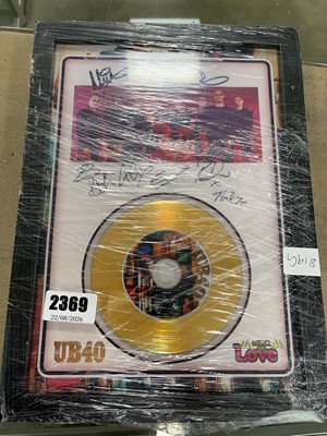 Lot 2369 - Framed UB40 Labour of Love single with...